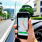 **Prompt:** A modern tourist stands on a well-maintained street in Bandar Seri Begawan, Brunei, holding a smartphone with a ride-hailing app (like Grab) clearly visible on the screen. A sleek, clean car, reminiscent of a ride-hailing vehicle, is pulling up in the background. The scene emphasizes convenience, digital age travel, and the ease of getting around the city. Bright daylight, clear skies, and a backdrop that suggests a well-developed urban environment.